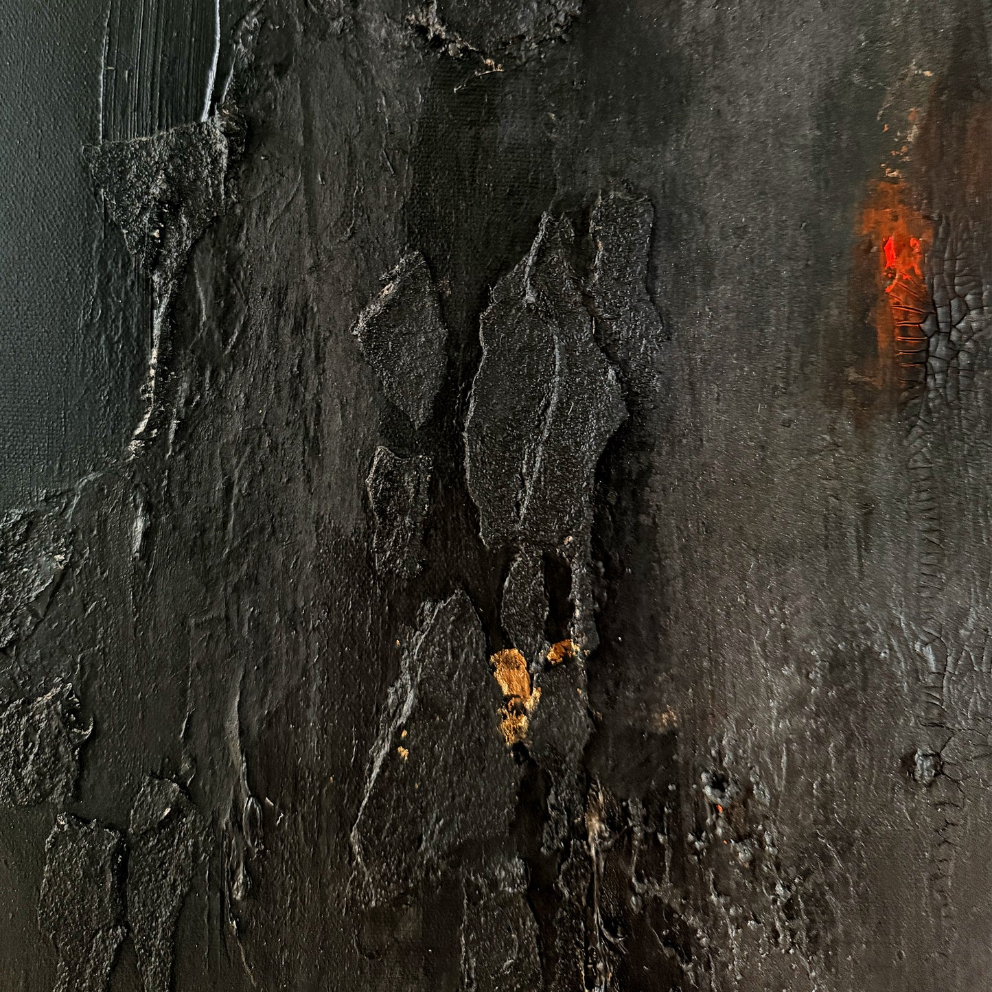 Close-up of textured dark surface with orange accents