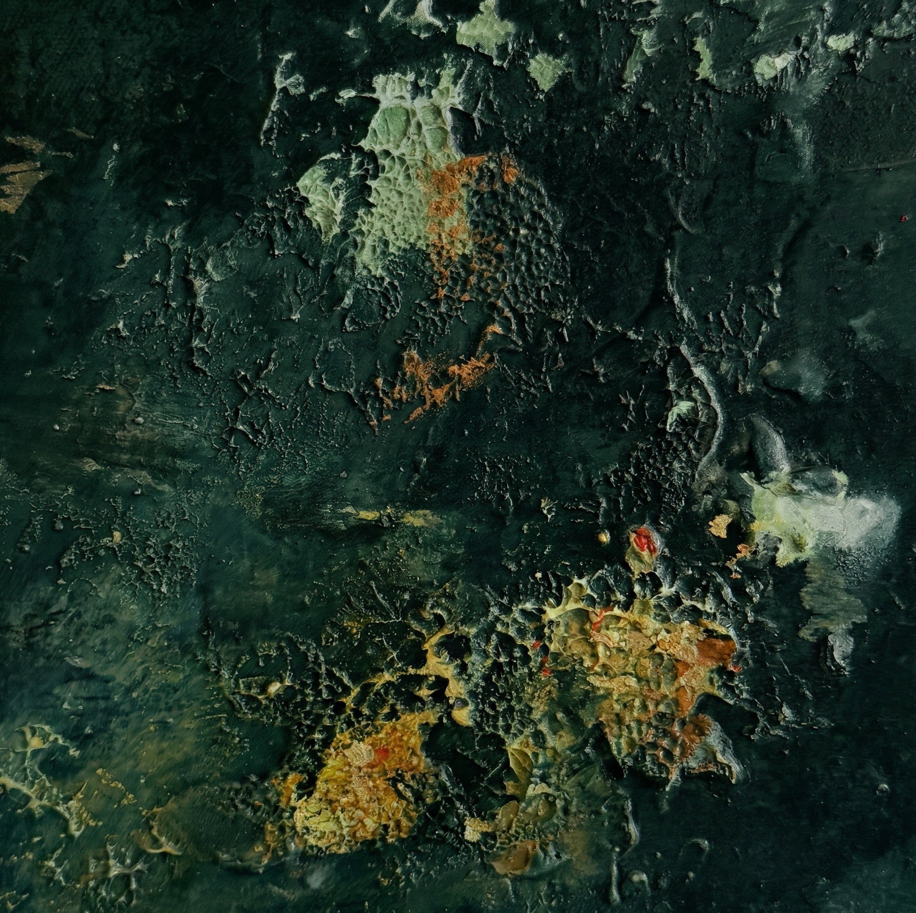 Close-up of a textured surface with orange and gray colors