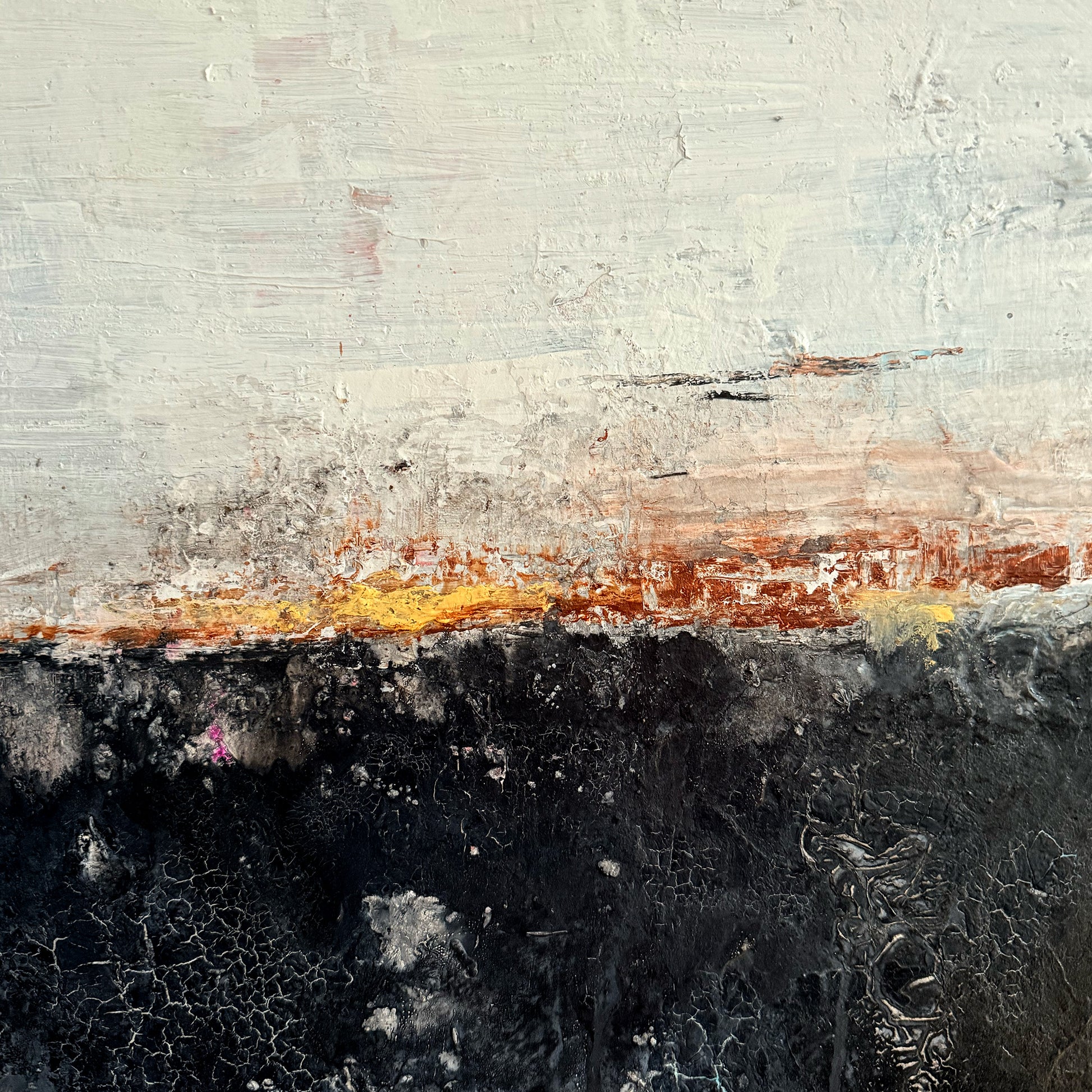 Abstract art with a gradient from gray to black and orange, textured surface.