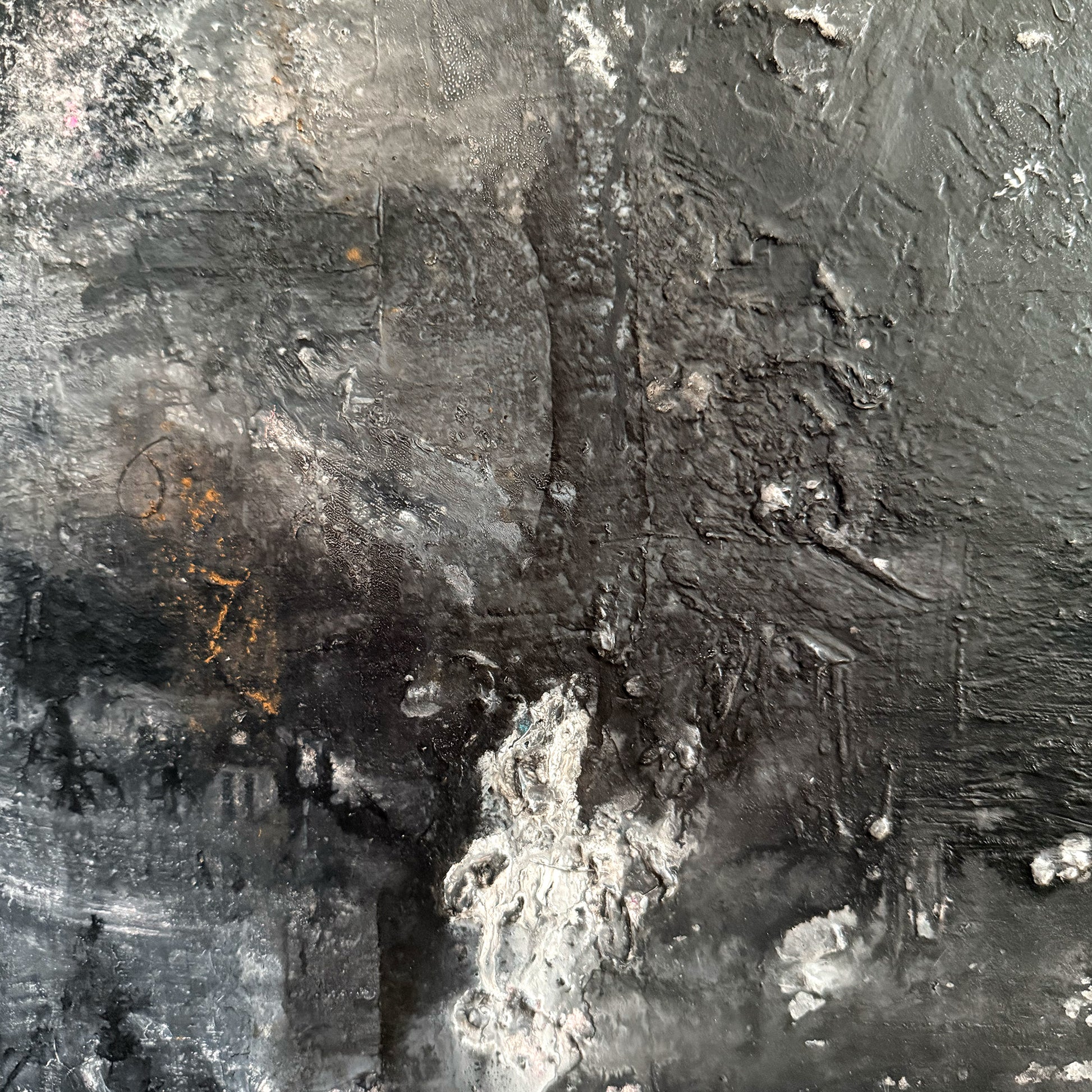 Close-up of an abstract black and white painting with textured surface