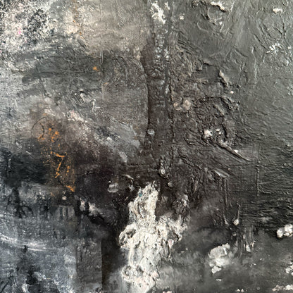 Close-up of an abstract black and white painting with textured surface