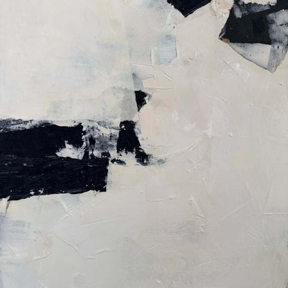 Abstract art piece with black and white brush strokes on a textured surface