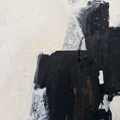 Abstract art with black and white brush strokes on a textured surface