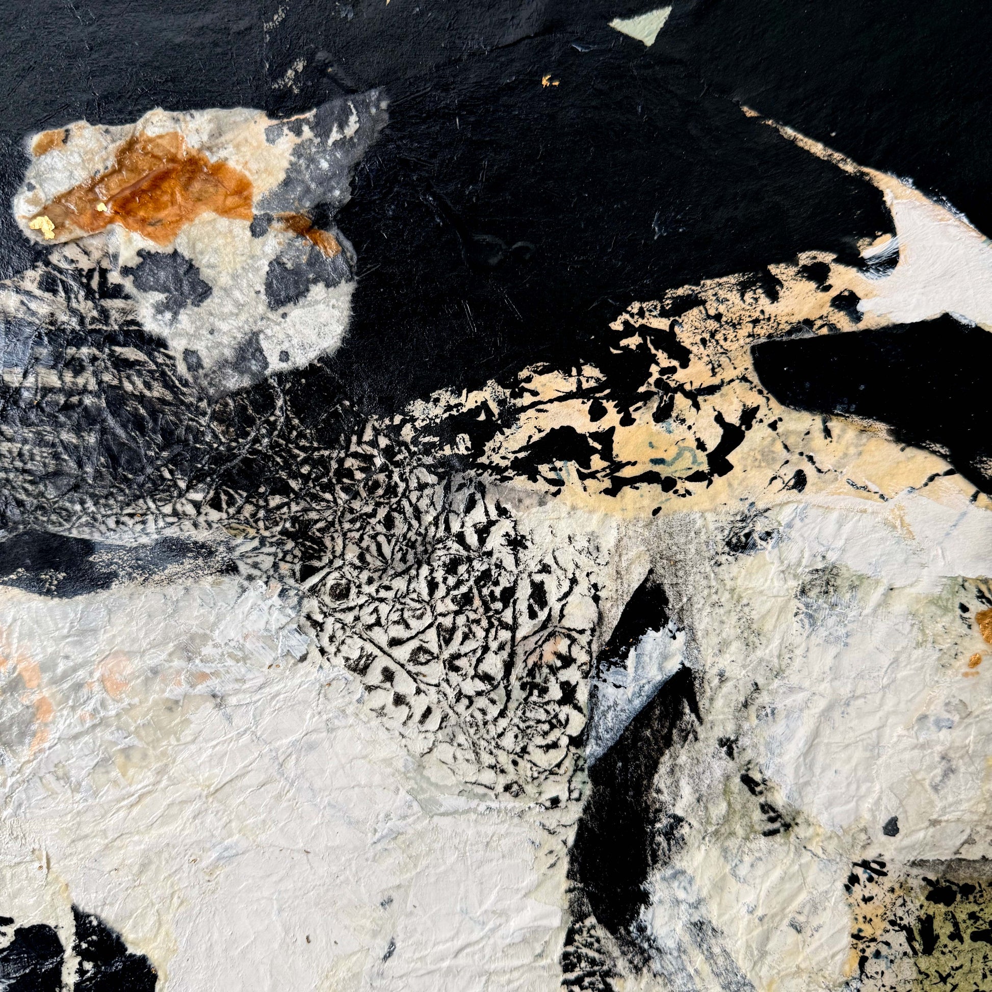 Abstract art piece with black, white, and brown colors
