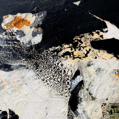 Abstract art piece with black, white, and brown colors