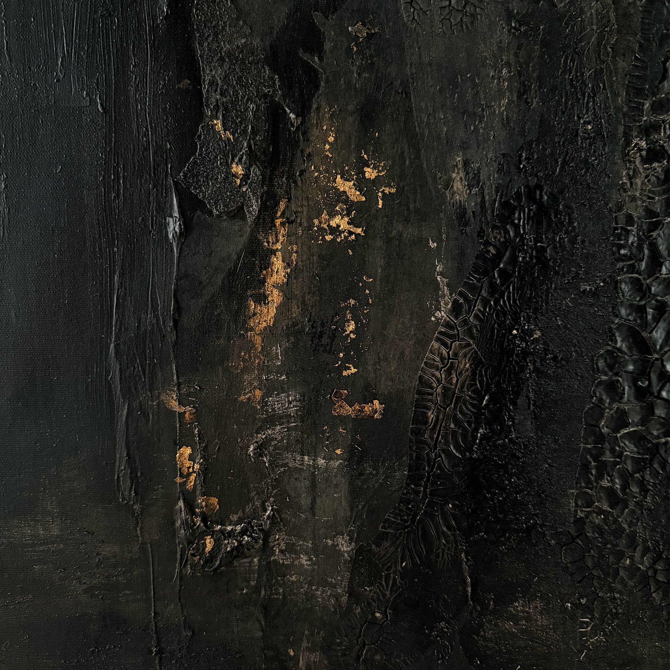 Textured black surface with gold accents