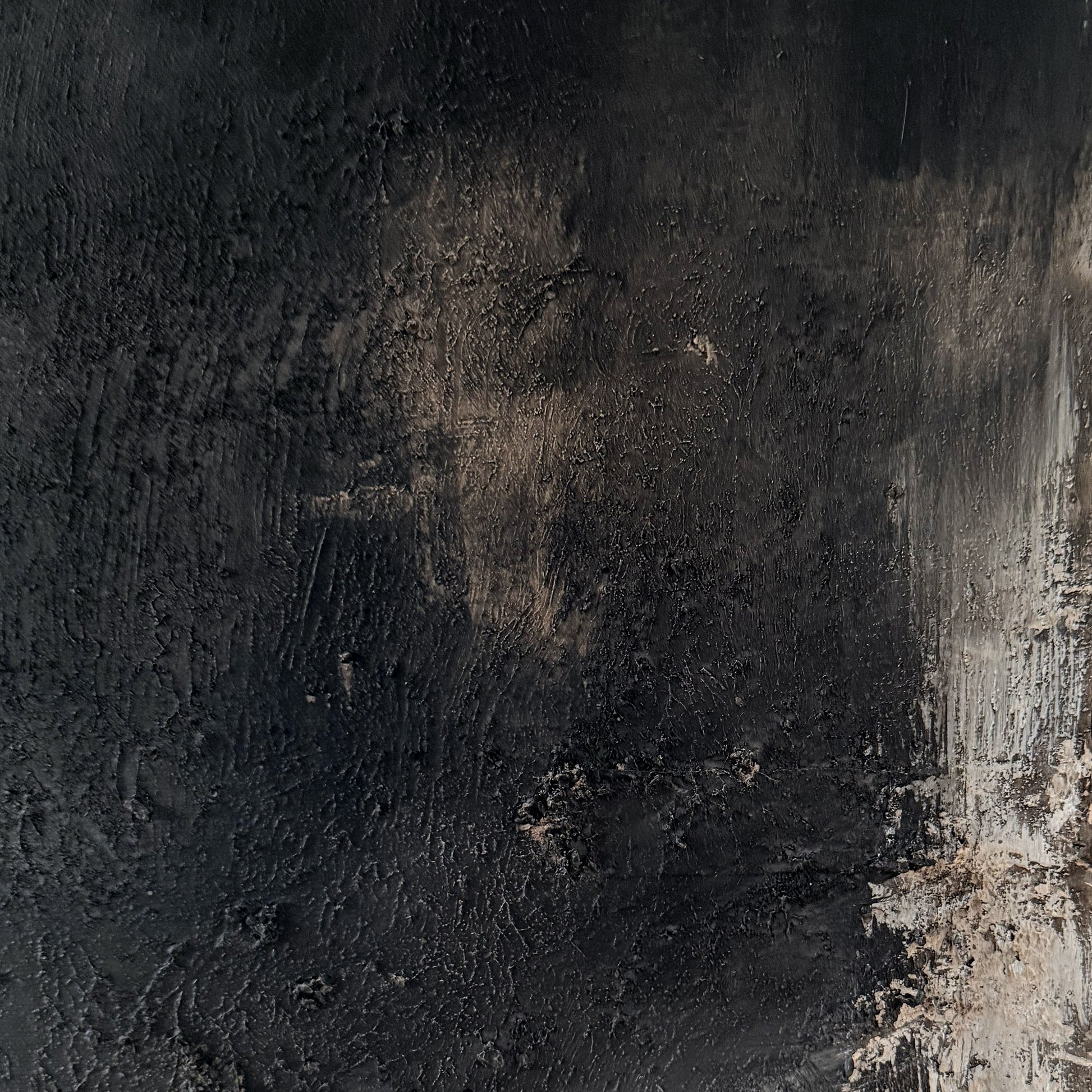 Textured black and brown surface with a rough texture