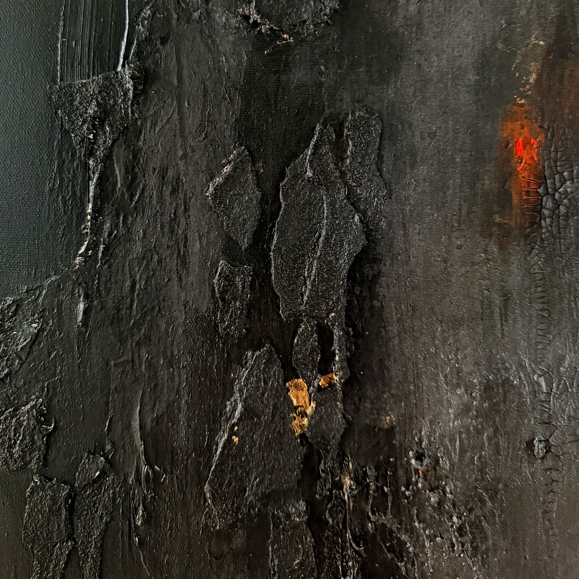 Close-up of textured dark surface with orange accents
