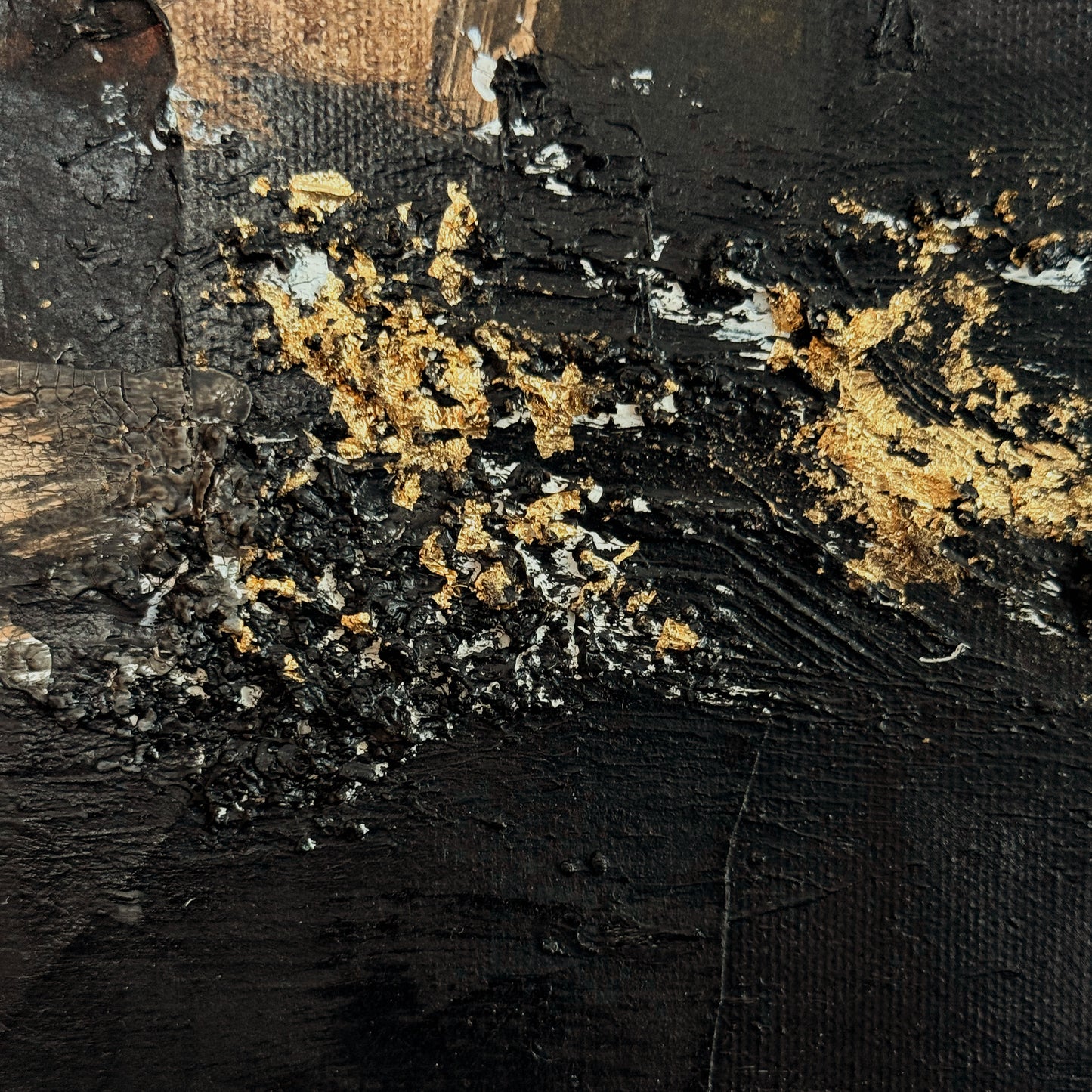 Close-up of textured surface with gold and black elements