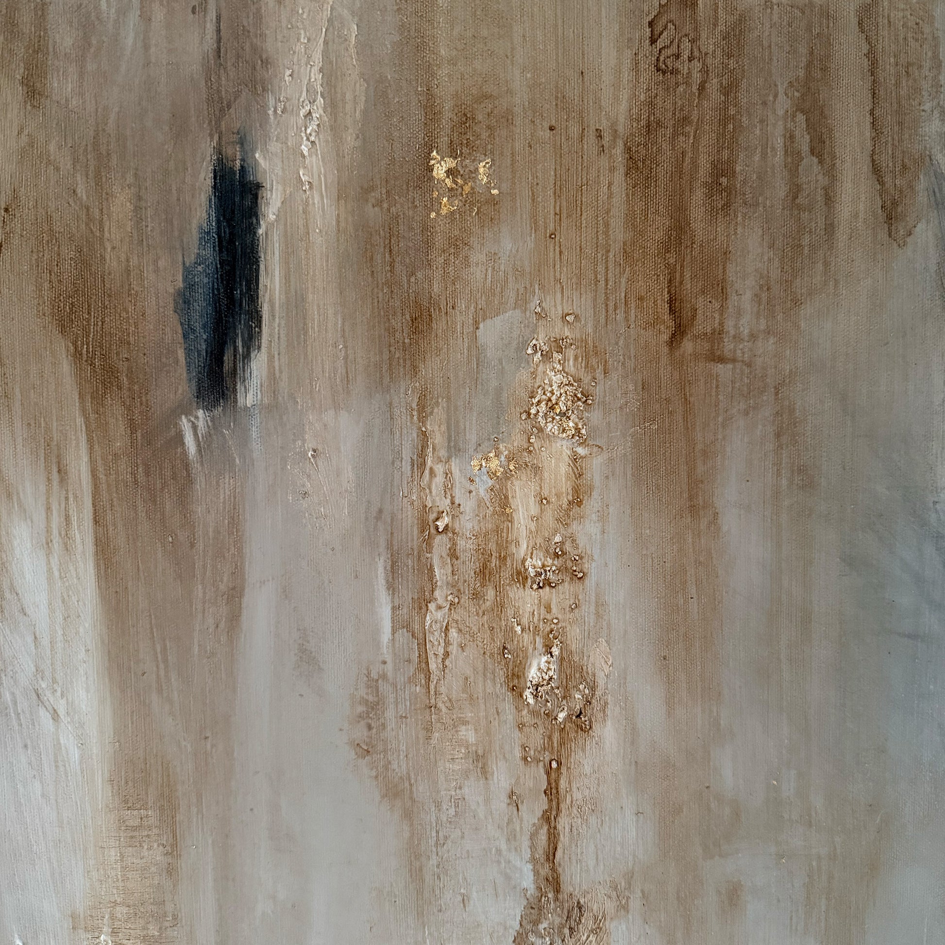 Abstract art with brown, black, and gold colors on a textured surface