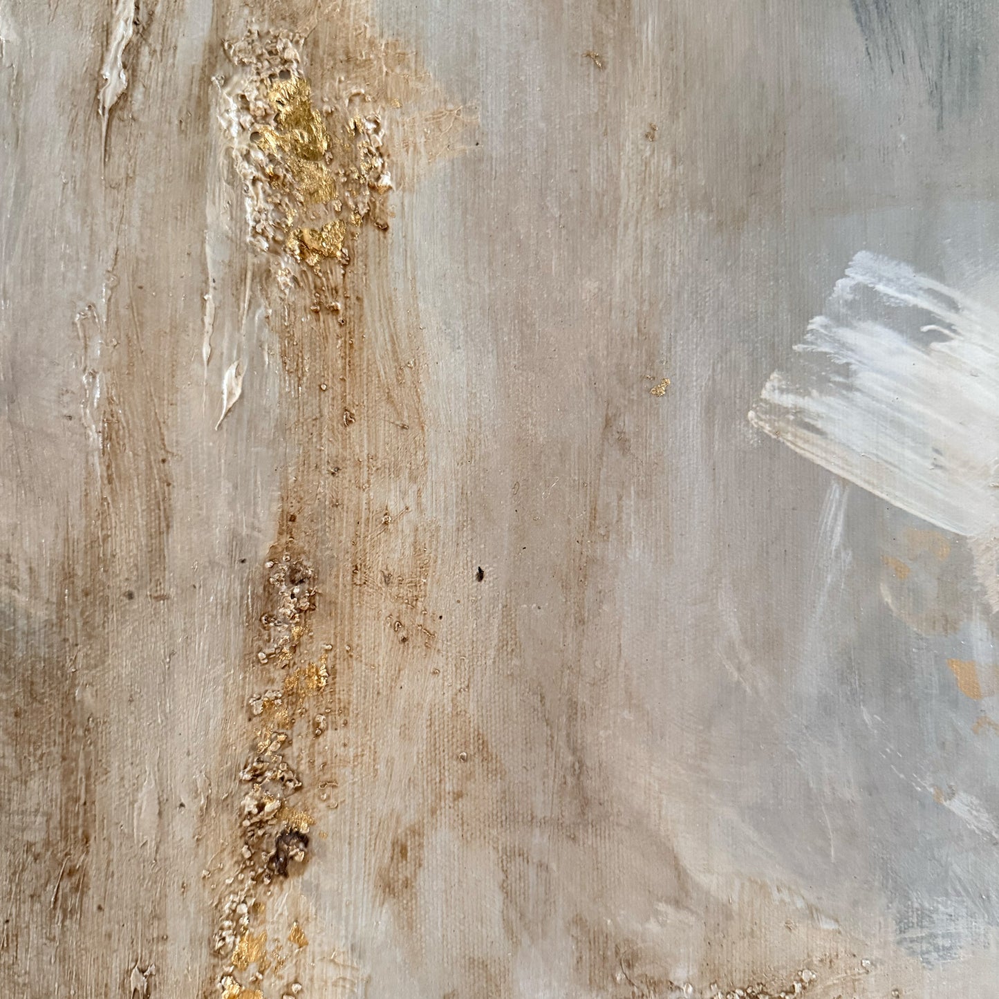 Abstract art with gold accents on a textured surface
