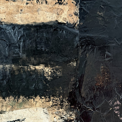 Close-up of textured stone surface with dark and light brown tones