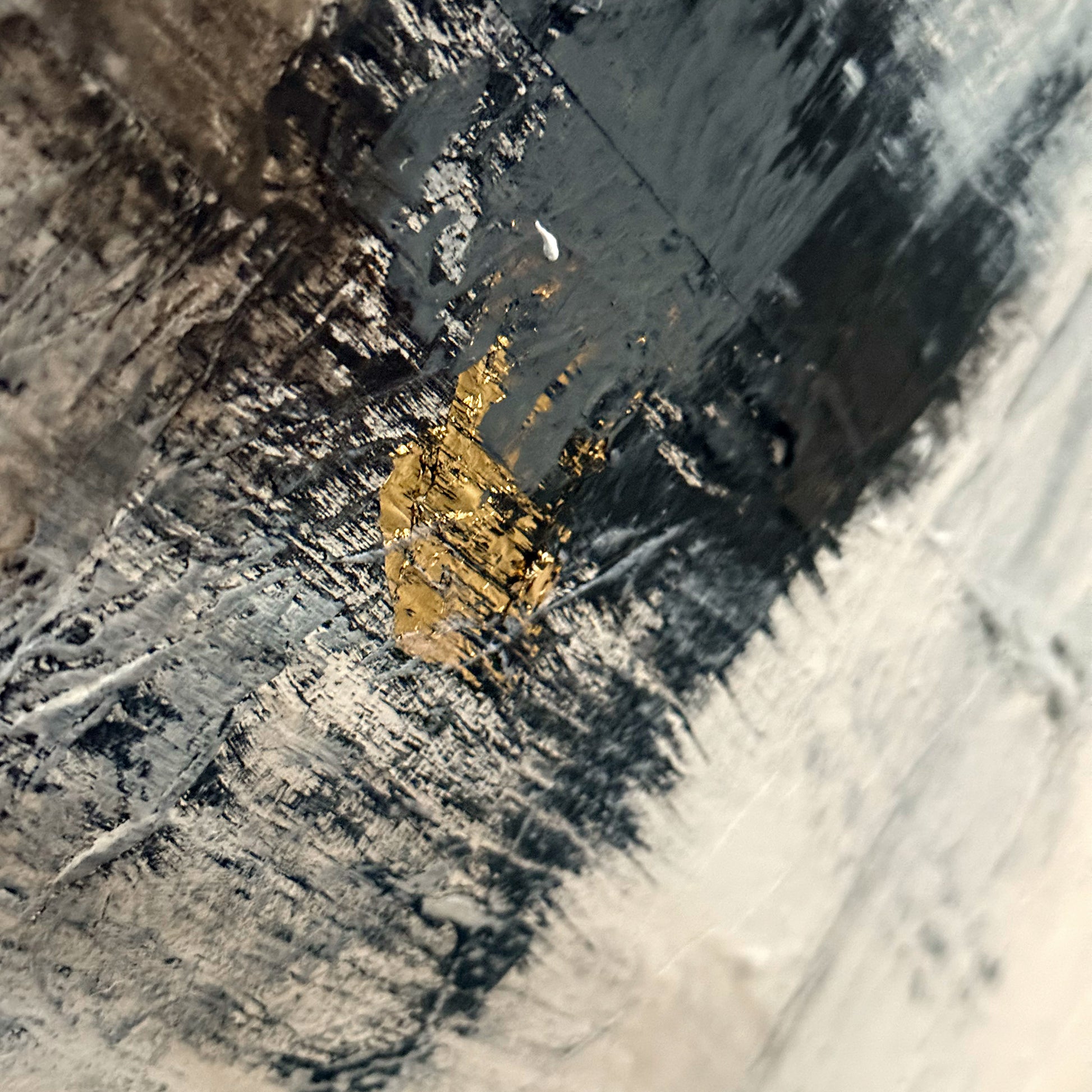 Close-up of a gold nugget on a textured surface
